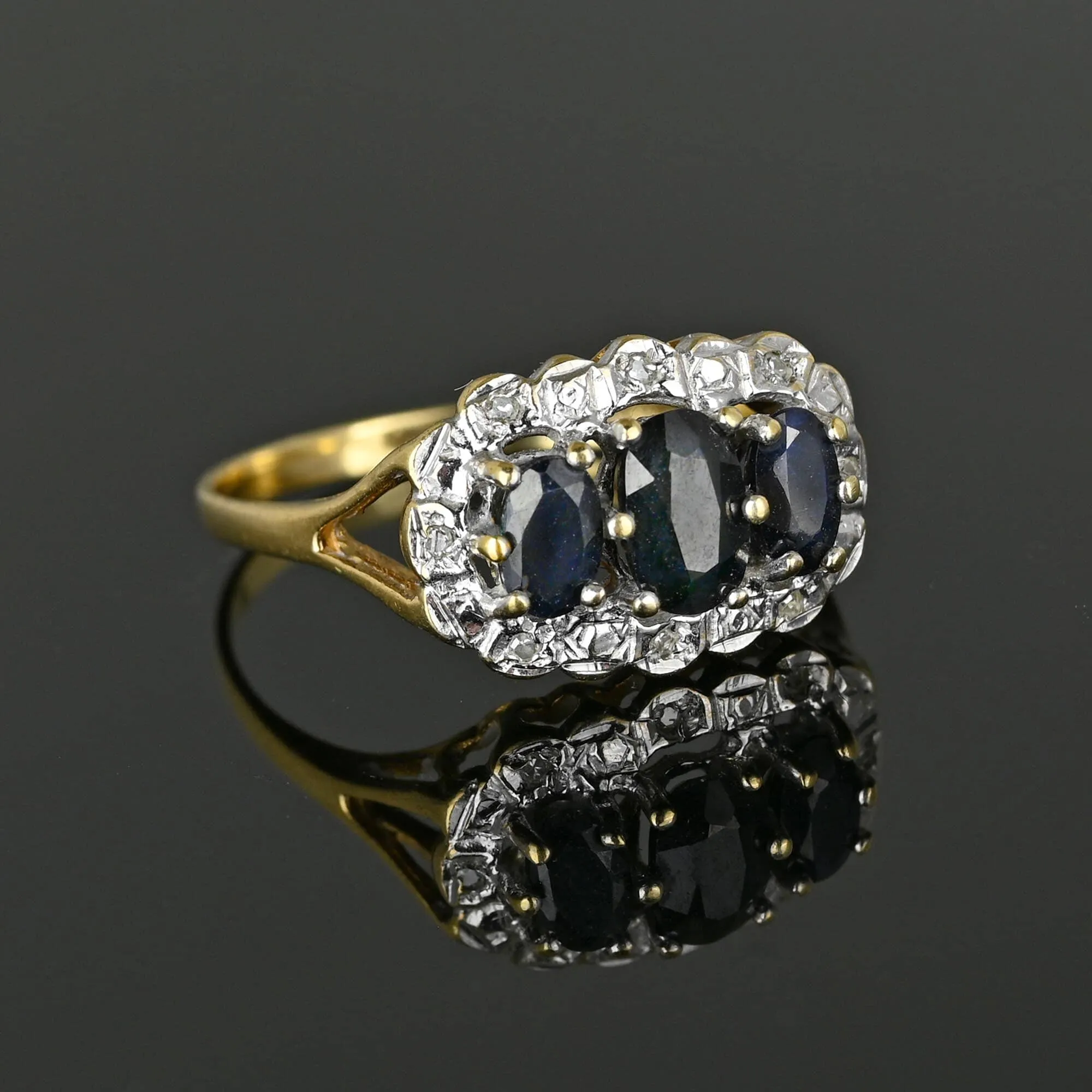 Diamond Halo Three Stone Sapphire Ring in Gold