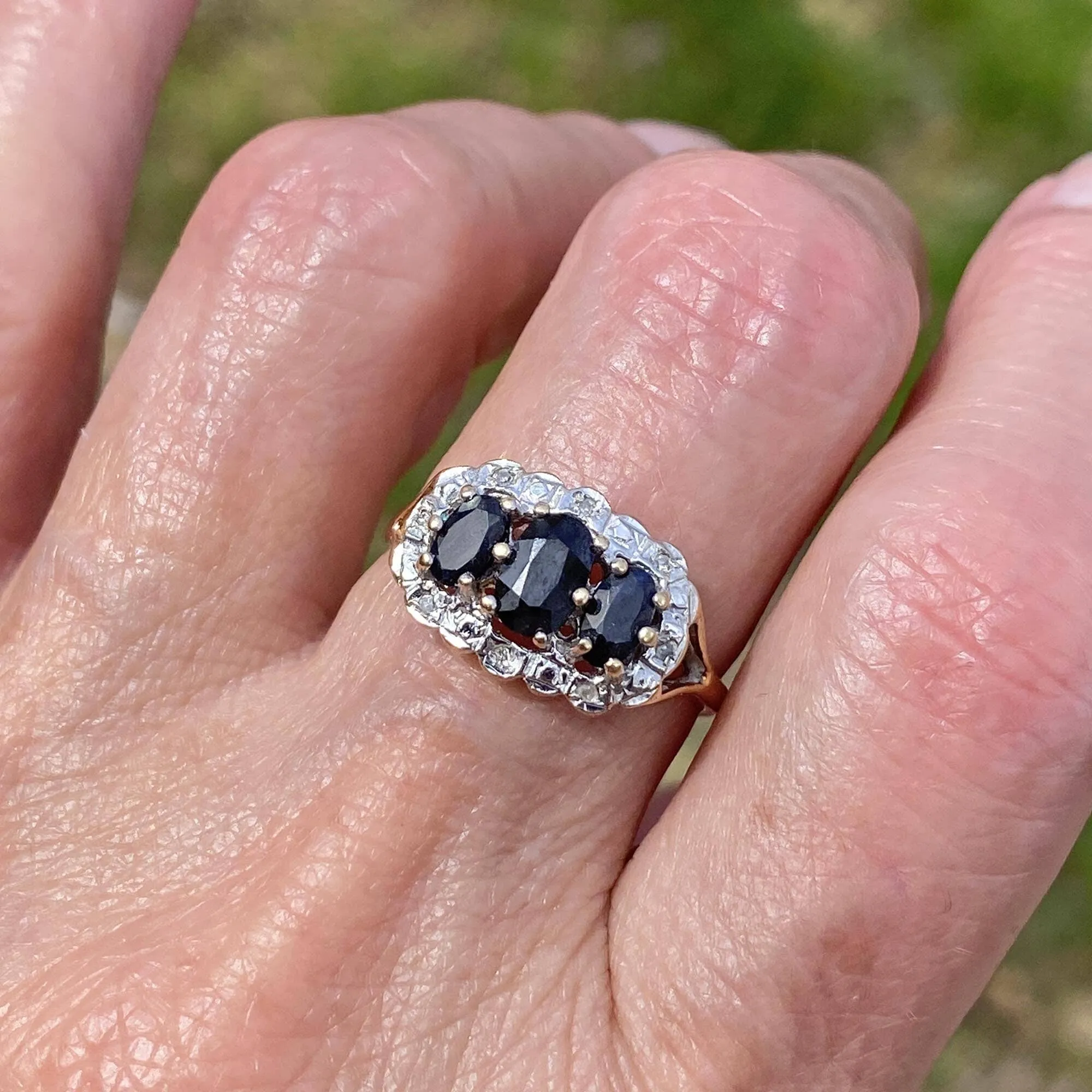 Diamond Halo Three Stone Sapphire Ring in Gold